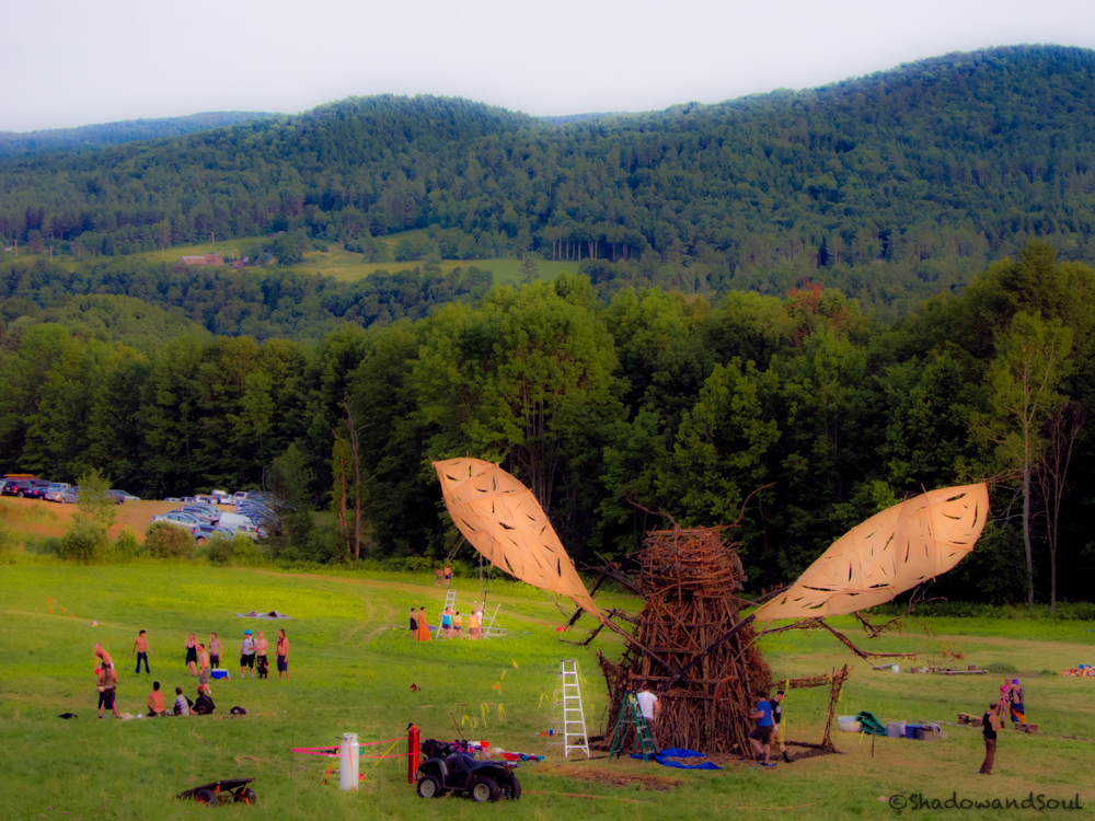 TanyaRose2012A A view from the hill down to the field, where the 2012 bug is surrounded by people.