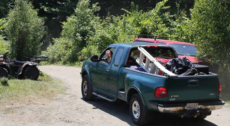 pretzel2018J A loaded pickup truck drives along a path.